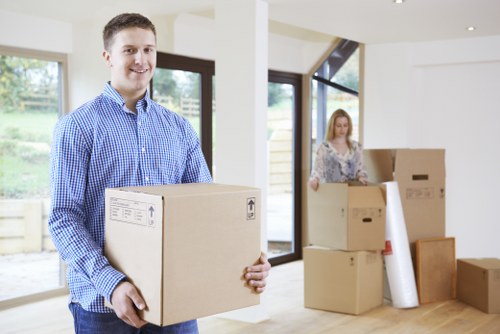 Loading boxes and furniture into a removal truck in Finchley