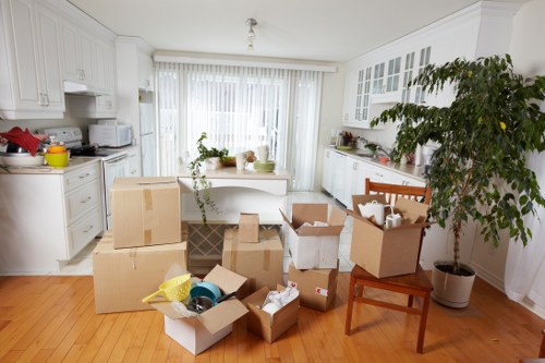 Removal van loading boxes and workstations during a Finchley commercial move