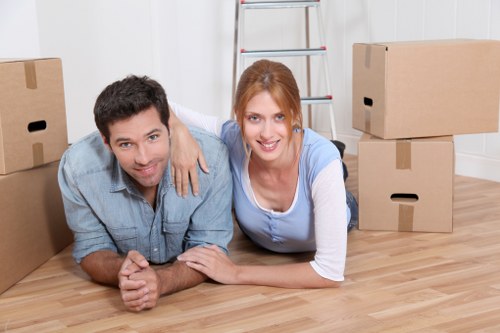 Loading boxes and household items into a van in Finchley