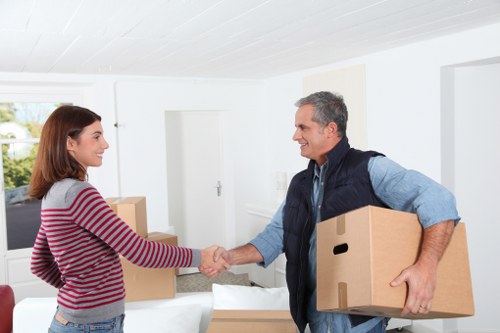 Packed office furniture and equipment ready for relocation in Finchley