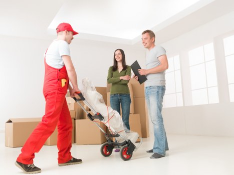 Local movers handling household items for a Finchley family move