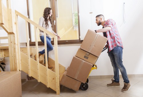 Local moving team packing items for a student move in Finchley