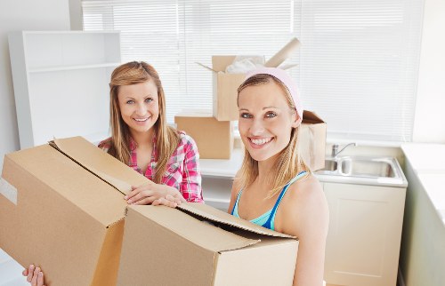 Careful loading of large furniture items for removal in Finchley