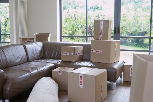 Careful loading of household items outside a Finchley property