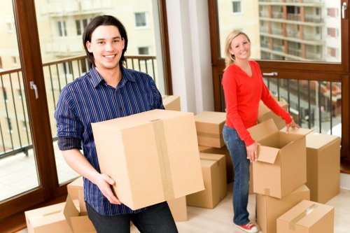 Loading household furniture into a van for transport in Finchley